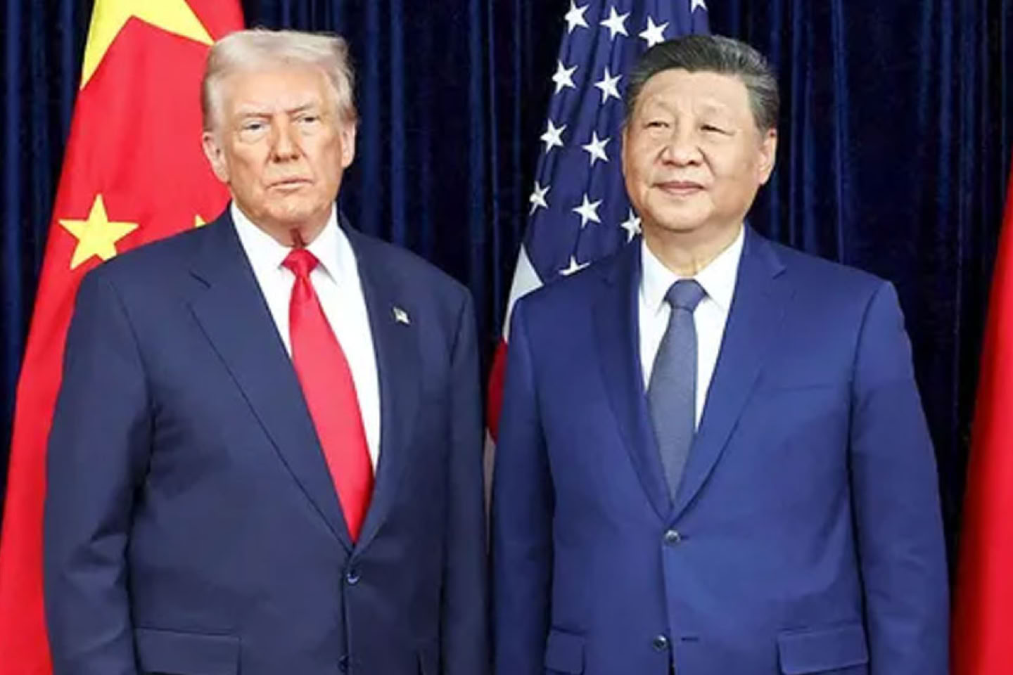 Donald Trump and Xi Jinping in suits standing in front of their country flags.